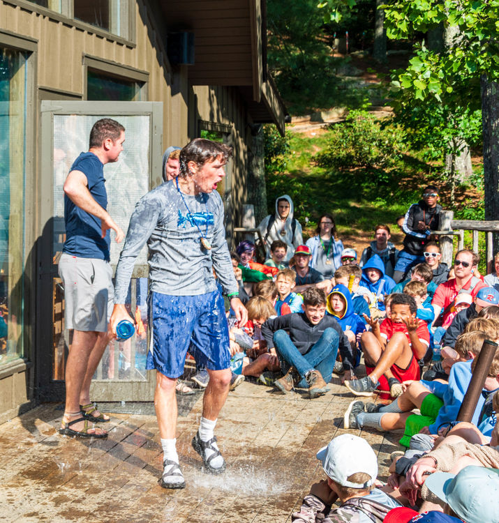 Patrick McGrady displaying some positive attitude (and mostly excitement!) about paddling during Morning Assembly