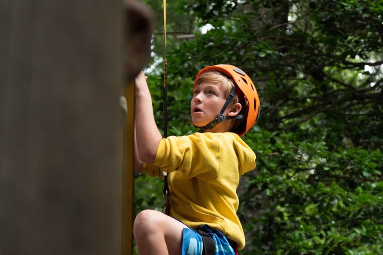 Will in one of his activities other than pottery, mastering the climbing wall