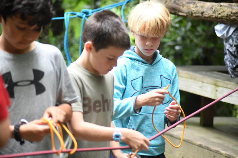 Learning how to tie knots at the climbing wall