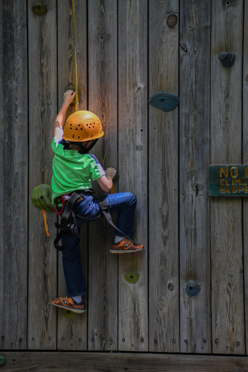 Reaching high at the climbing wall