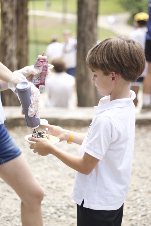 Getting all the toppings during Sunday ice cream sundaes!