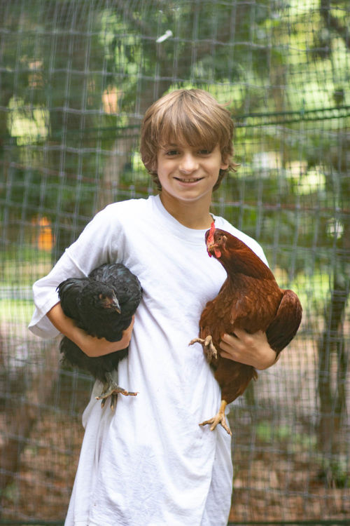 Hanging out with Inky and Queenie, two of camp’s chickens