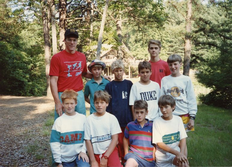 Yates with his June Camp Cabin in 1987, including a young Kelly Odom