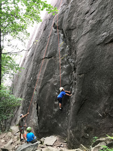 Campers climbing at camp.