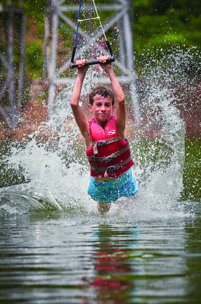 Camper enjoying the activities at one of our camp lakes.