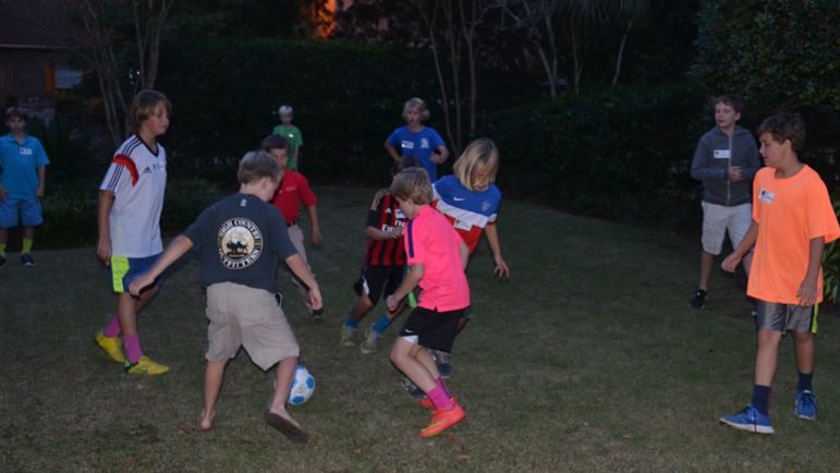 The boys enjoy playing a little soccer and eating some pizza before we all watch the new camp movie.