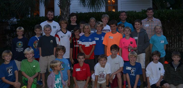 Returning campers, boys who have come to learn more about camp, staff members, and dads who have attended Father/Son Weekend, pose for a shot while attending the Charleston Show.