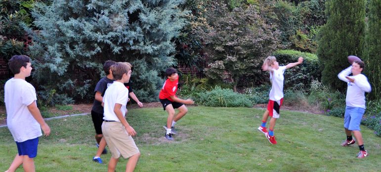 No surprise that a quick game of football started up in the back yard between the pizza and show time.