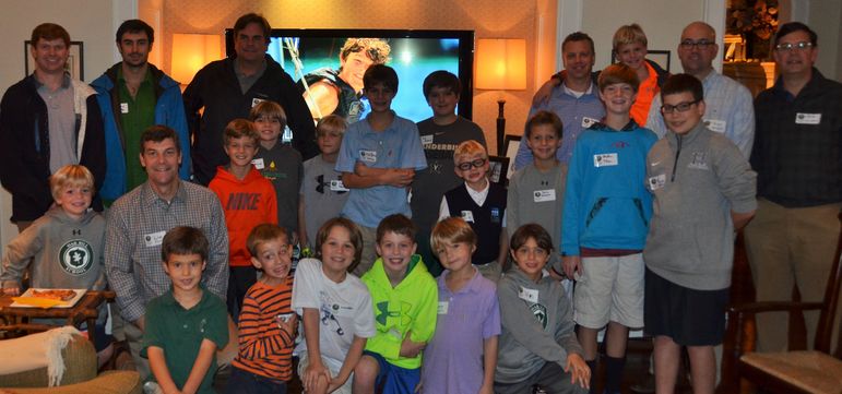 Falling Creek campers, boys that came to learn more about FCC, staff, alumni, and dads that attended Father/Son Weekend pause for a group shot before Yates begins the program.