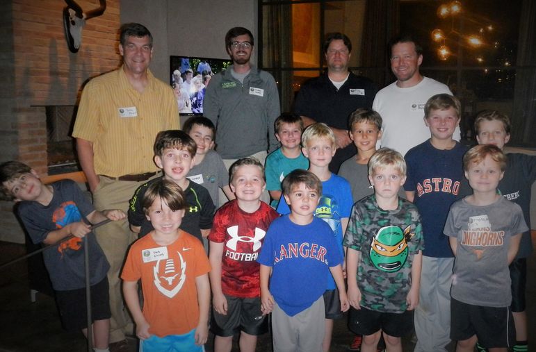 The boys paused from playing a ball game in the back yard to take a group shot.