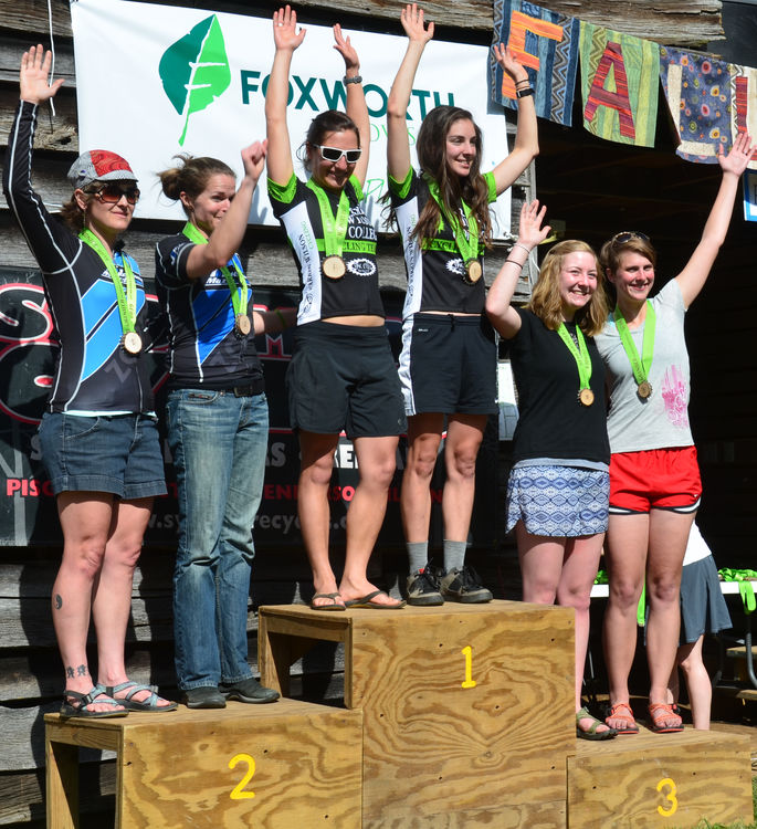 FCC Staff member Allison Jones (3rd from right) and Annie Pharr (2nd from right) represented on the podium in the open women’s race.