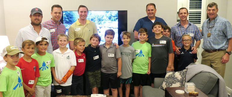 Alumni and dads who have come to Father/Son Weekend joined the group photo with the boys in the Orlando area