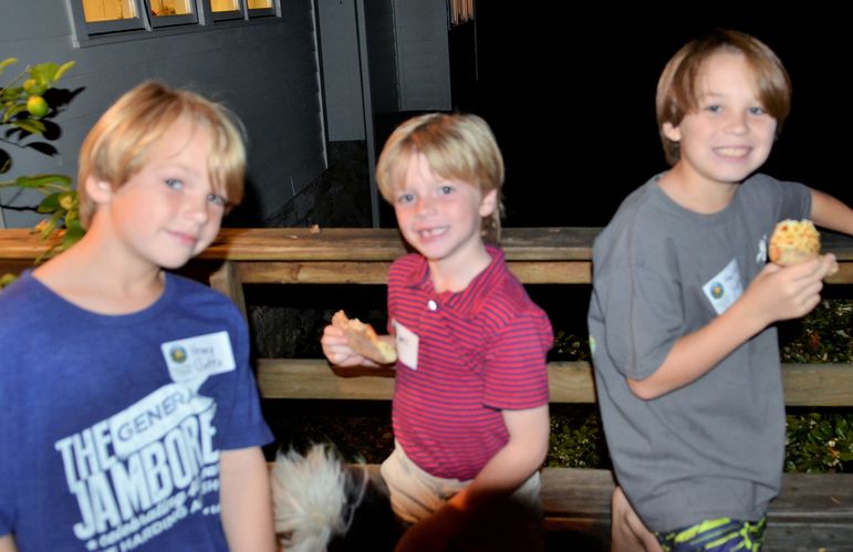 The boys enjoyed eating some pizza out on the back porch.