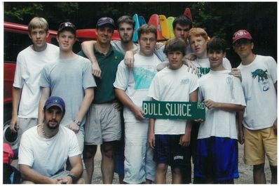 John, center with arm around Program Director Chris Stec, helped FCC win the the famous Bull Sluice award from a tough group of Camp Merrie-Woode paddlers in 2001.