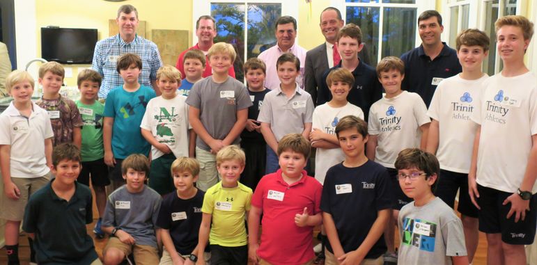 The boys paused for a photo with alumni and dads who have attended Father/Son weekend