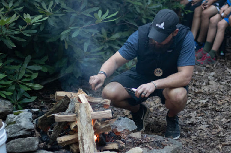 Kyle starting the campfire for Tuscarora’s tribal campfire night